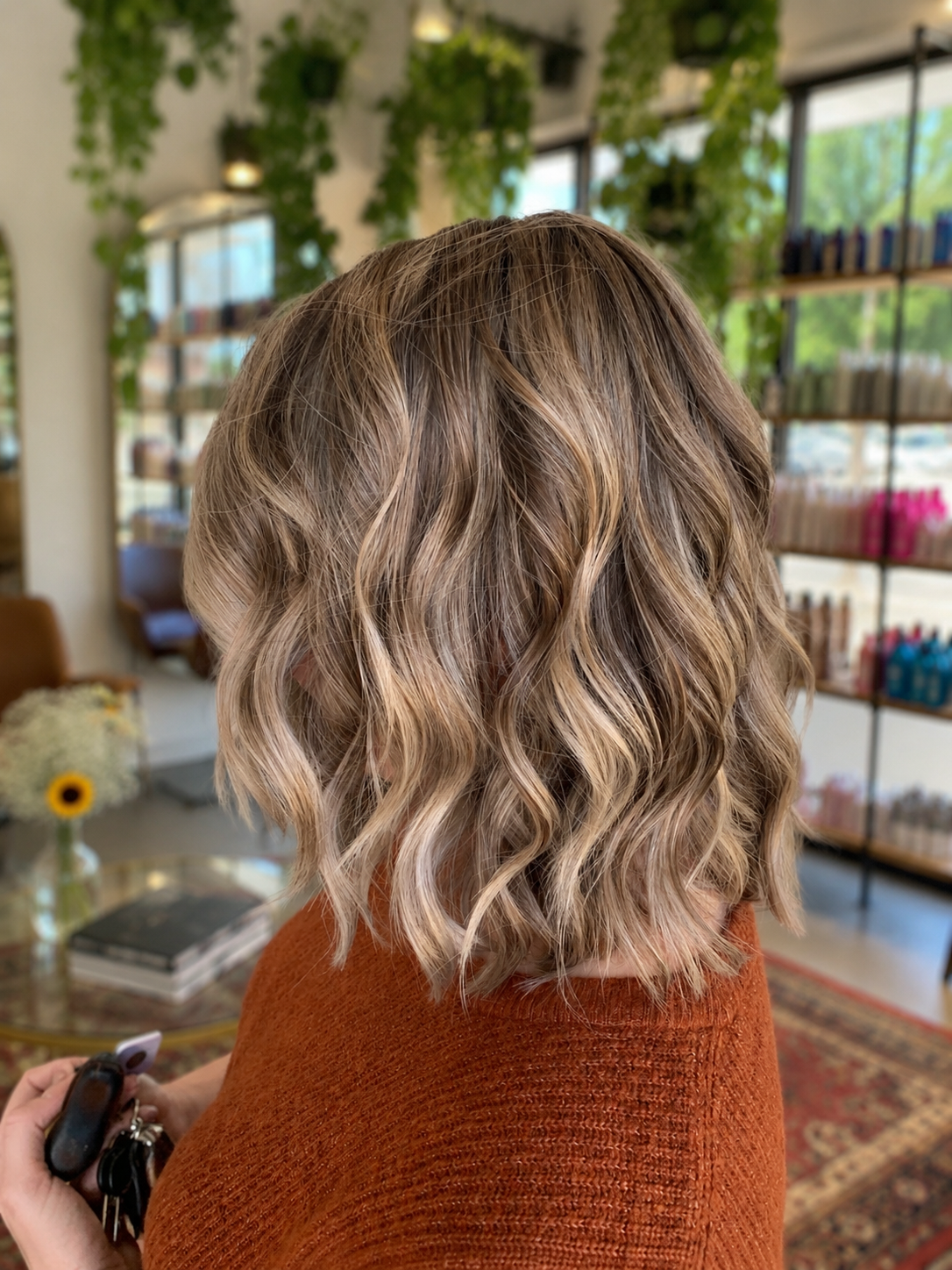 Dimensional blonde waves with a warm salon finish at Salon NB